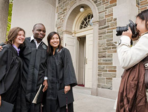 Students getting their photo taken. Links to Gifts of Life Insurance